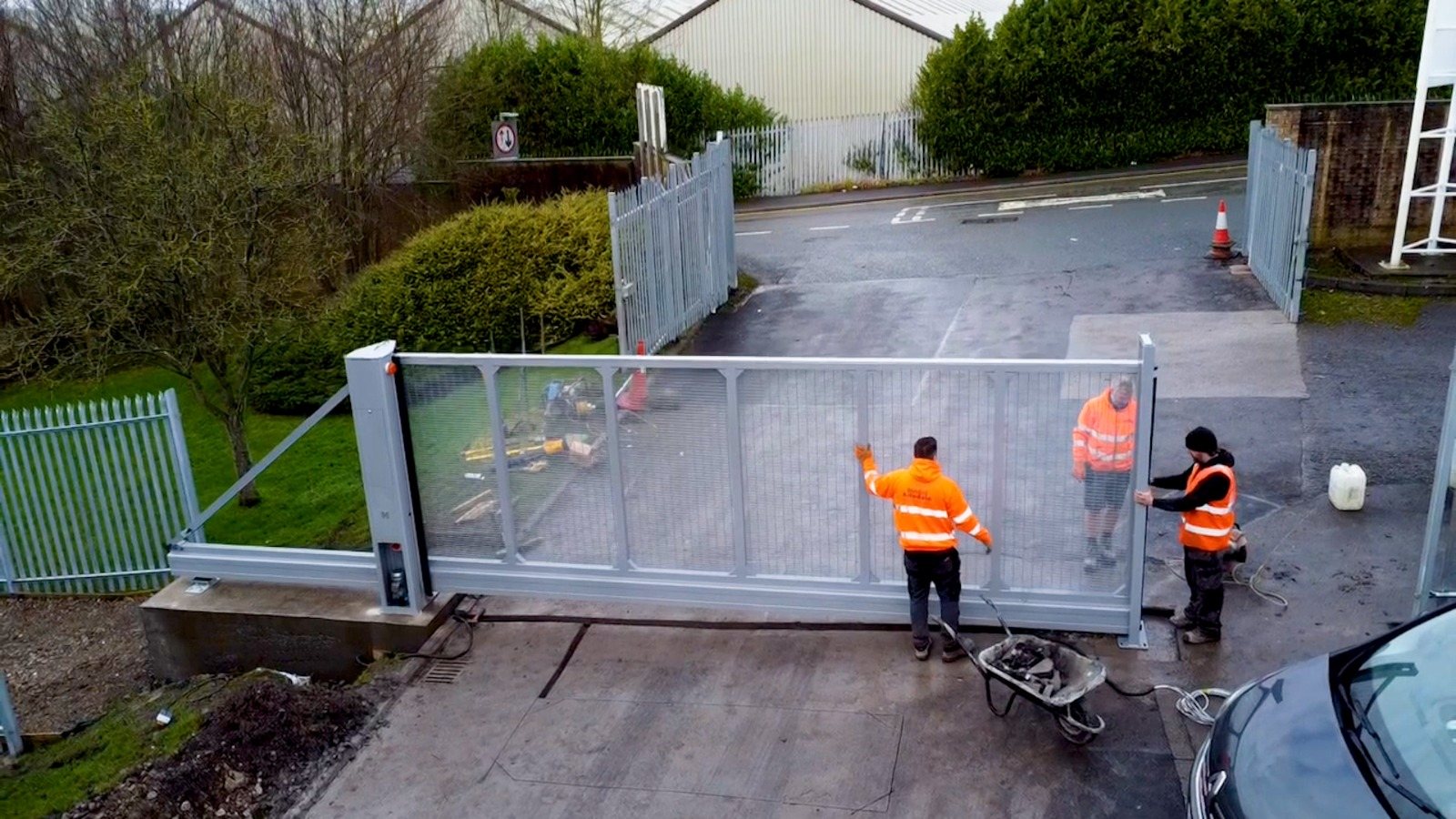 Cantilever sliding gate installation in progress, showing the track and operator